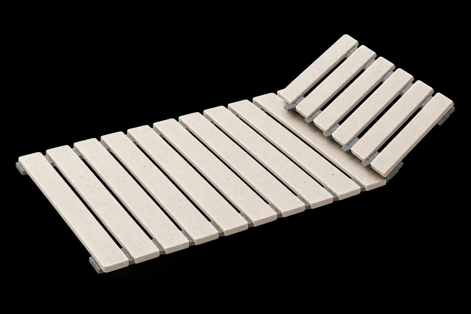 Two MT Living stone drying mats seen at an angle, one raised behind the other