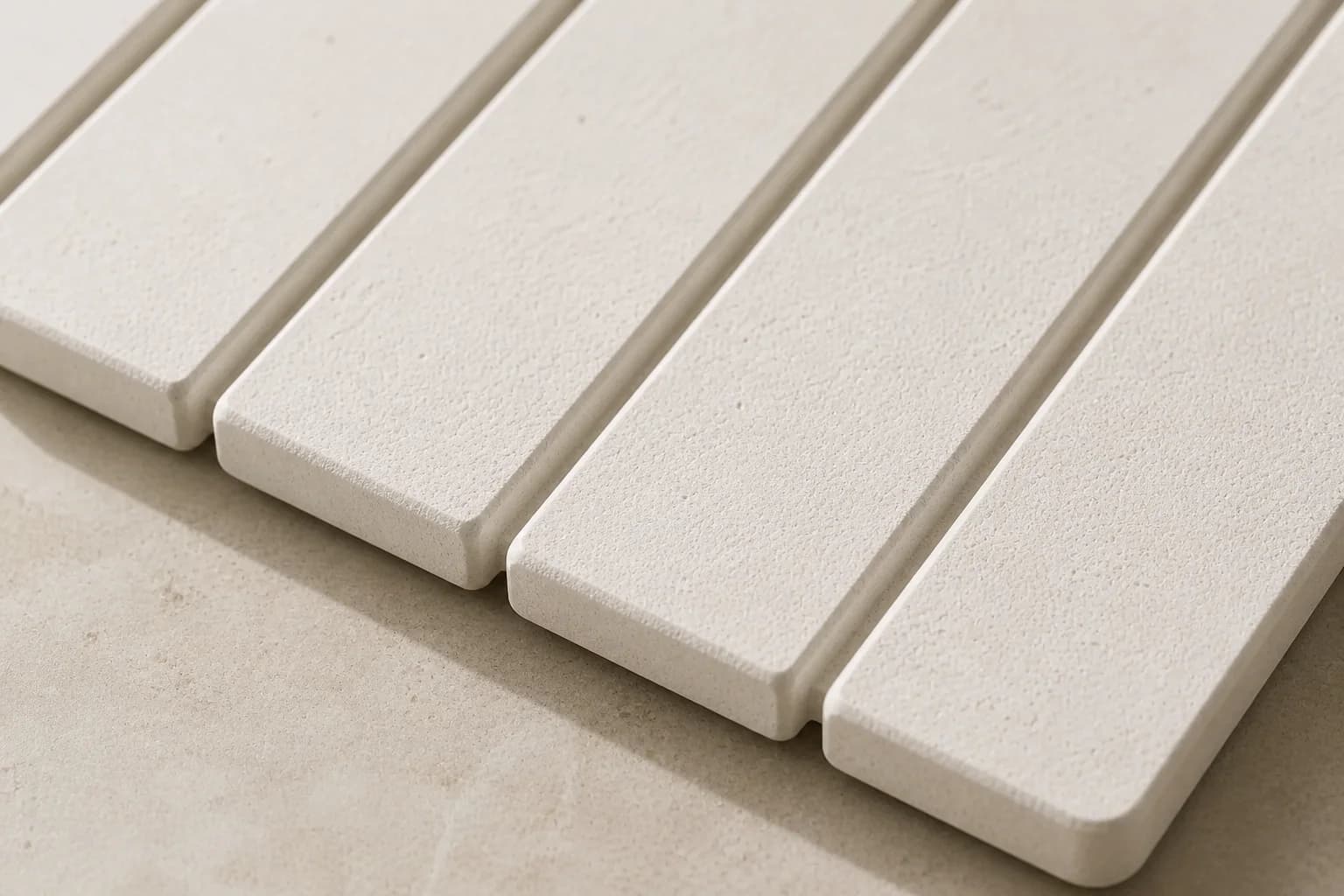 Close detail of the stone slats of an MT Living drying mat on a stone counter